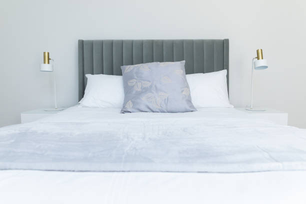 istock Double bed design in blue and white tones in modern style with nightstands on both sides 1440978886