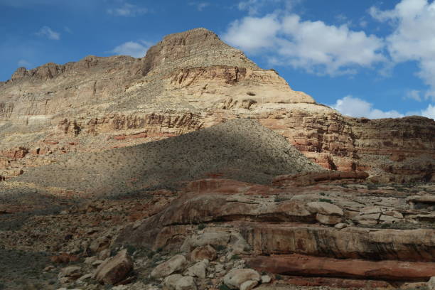 istock Mesmerizing view of the cloudy blue sky over the rock formation under the sunlight 1440979081