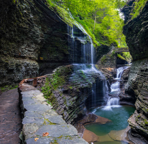 Rainbow Falls at Watkins Glen State Park, Finger lake region, upstate New York, USA The Rainbow Falls at Watkins Glen State Park, Finger lake region, upstate New York, USA finger lakes stock pictures, royalty-free photos & images