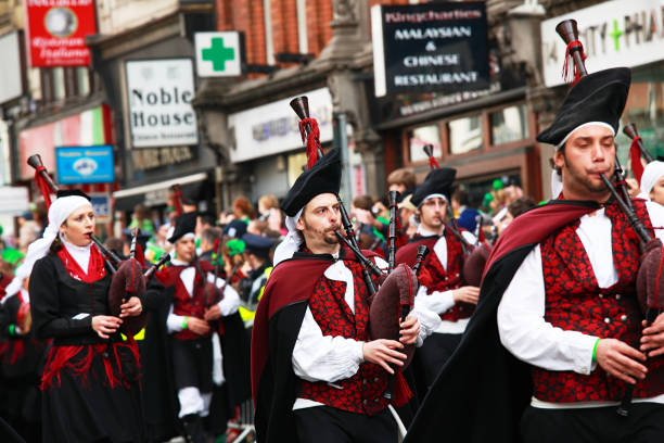 dublin, Ireland – March 10, 2022: Dublin, Ireland - March 17, 2022 St. Patrick's day parade in Dublin, Ireland.Cheerful participants at the St. Patrick's Day Parade