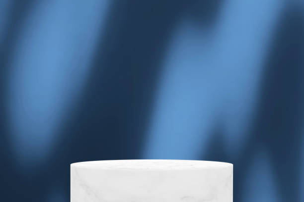 istock White Marble cylinder Podium with Bokeh, Light and Shadow on French Blue Tone Background (3D illustration), Suitable for Product Presentation Backdrop, Display, and Mock up. 1440979362