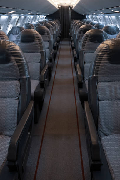 istock Vertical shot of the empty airplane aisle. 1440979538