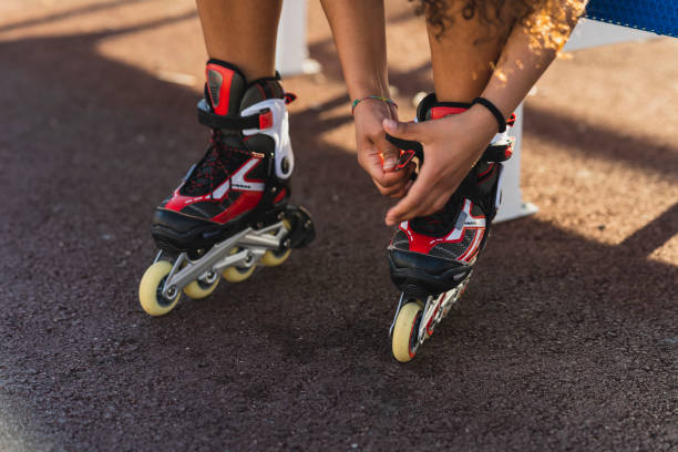 istock Woman putting on the rollers skates 1440979602