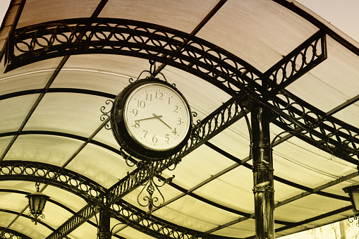 old retro clock of one central station in vintage image look