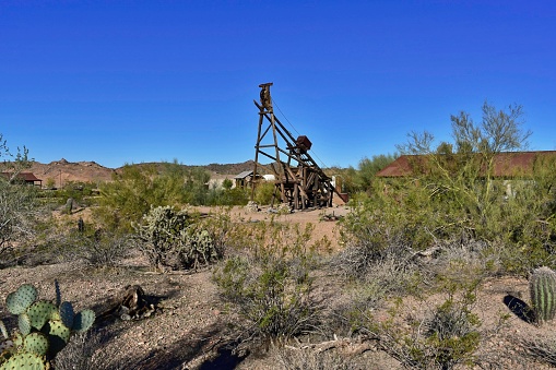 Wickenburg, United States – February 17, 2022: A look at some vintage mining equipment at the Vulture City Ghost Town and mine near Wickenburg, AZ.