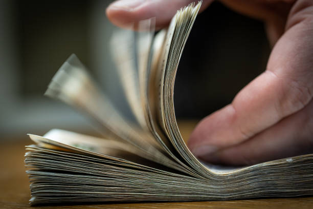 istock Close up on a hand checking bankontes 1440980830