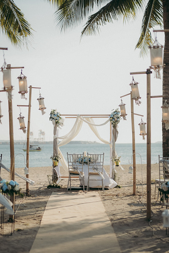 A vertical view of the wedding setup at the beach on a sunny day