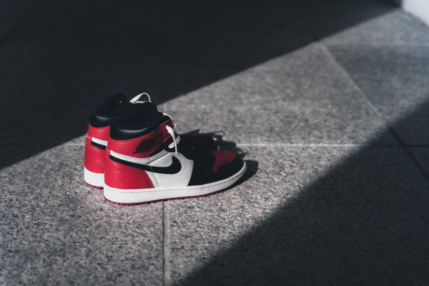 closeup shot of the jordan 1 retro black red sneakers. air jordans. - jordan imagens e fotografias de stock