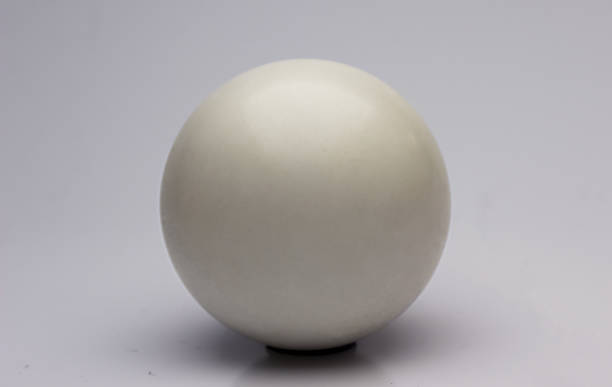 istock Closeup of a white ball isolated on a white background 1440981852