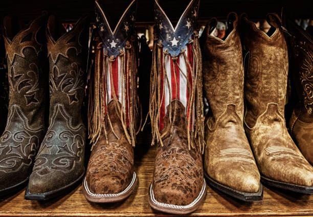 Closeup of Cowboy boots on sale in shops in downtown Nashville, Tennessee A closeup of Cowboy boots on sale in shops in downtown Nashville, Tennessee nashville stock pictures, royalty-free photos & images