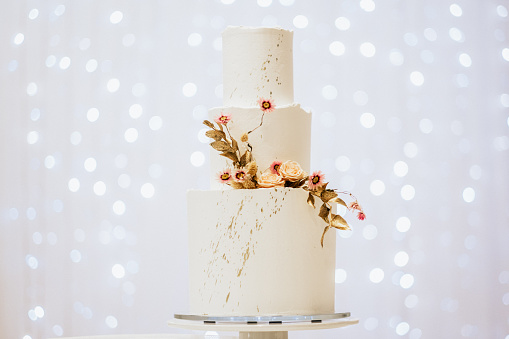 A beautiful wedding cake decorated with flowers