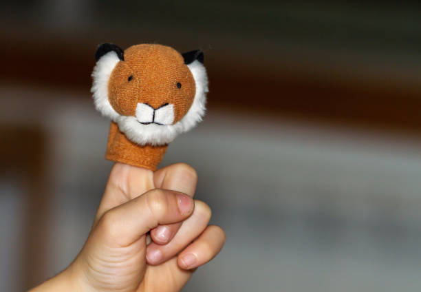 istock Non-recognizable hand with animal puppet on finger 1440983120
