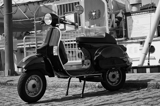 Luebeck, Germany – April 18, 2021: Vespa PX 80 built in 1994 in front of the old lightship