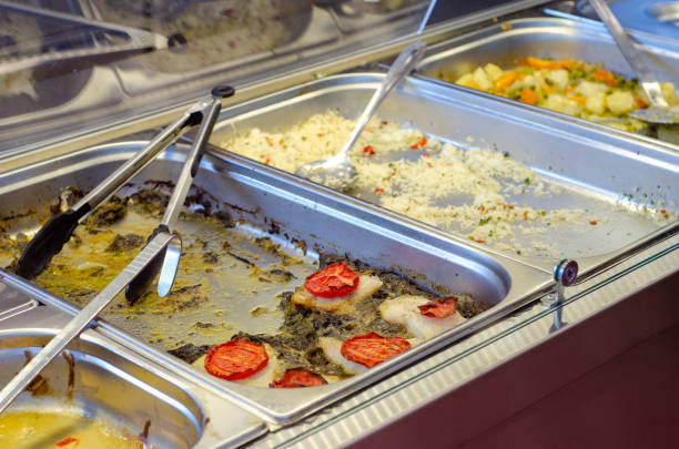 istock Catering bain-marie with empty leftover foods displayed in a cafeteria 1440984997