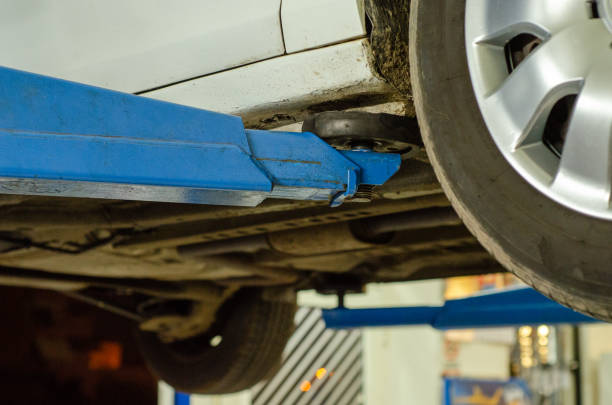 istock Car service - hydraulic ramp lift car 1440985044