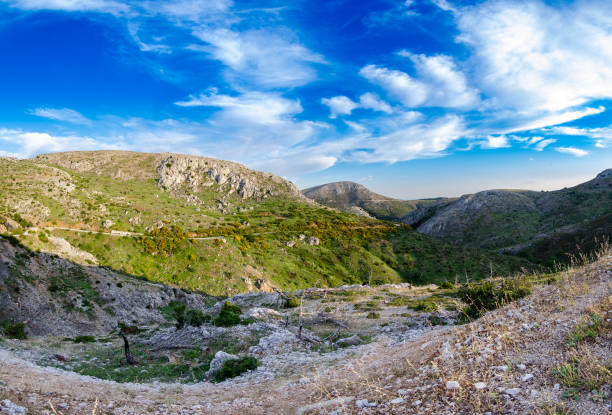 Mesmerizing view of Parnitha mountain range under a blue cloudy sky in Greece