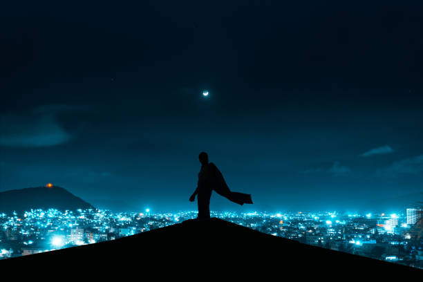 A beautiful shot of a man's silhouette under a night sky