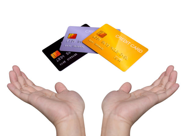 istock Hand showing credit card isolated on white background. 1440985339