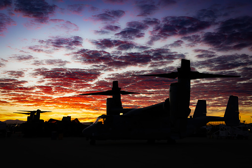 San Diego, California, USA - September 24, 2022: The sun rises behind a V-22 Osprey, before the crowds arrive, at the 2022 Miramar Airshow.