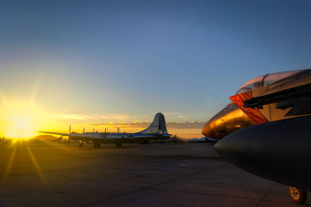 Sunrise on the Eagle San Diego, California, USA - September 23, 2022: A US Air Force F-15 Eagle gets the early morning sun with a B-29 Superfortress in the background at the 2022 Miramar Airshow. miramar air show stock pictures, royalty-free photos & images