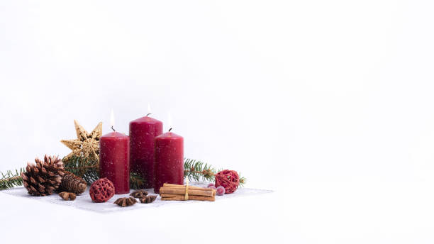 istock Christmas decoration with candles on white 1440987677