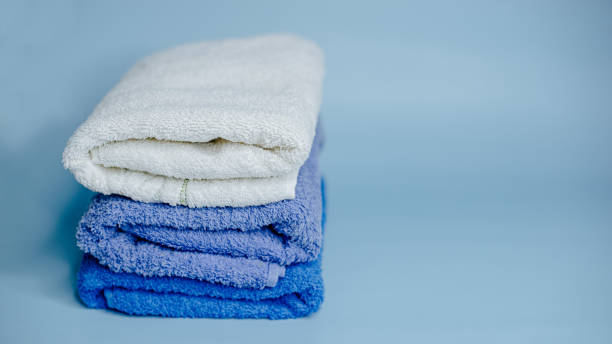 istock multicolored terry towels on a blue background 1440988167