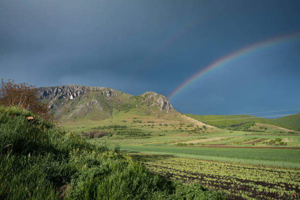istock Mesmerizing view of a beautiful mountainous landscape with a rainbow 1440989299