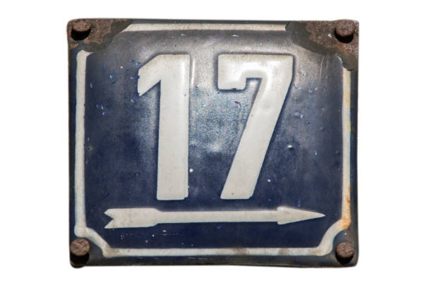 istock Weathered enameled plate number 17 1440990354