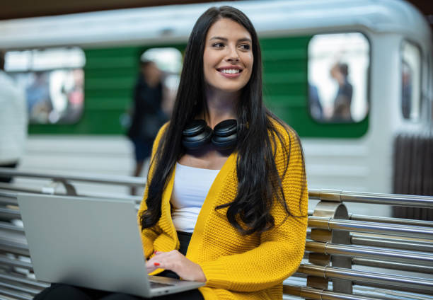Young student with headphones and laptop stock photo