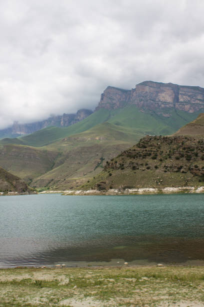 istock mountain lake Gizhgit among green hills 1440992582