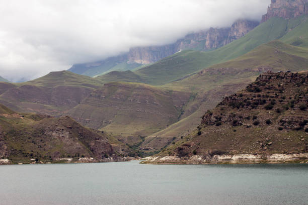 istock mountain lake Gizhgit among green hills on a cloudy summer day 1440992597