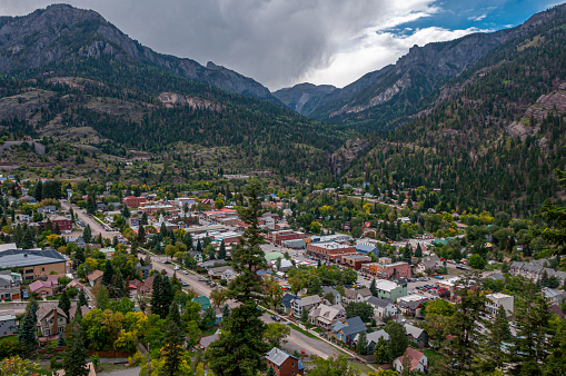 A mountain side view of the beautiful downtown of Ouray, Colorado, the outdoor recreation capital of Colorado from high on the Perimeter Trail that surrounds the city.