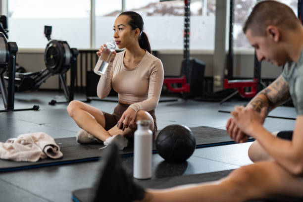 istock Couple taking a break in a gym 1440993662
