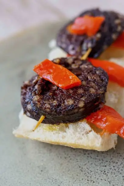 Burgos blood sausage with red peppers. Typical Spanish tapa skewer