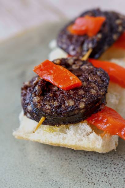 burgos blood sausage with red peppers. typical spanish tapa skewer - cooked studio shot close up sausage imagens e fotografias de stock