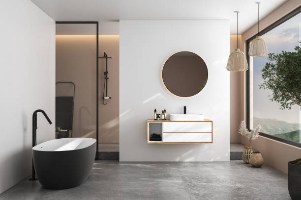 istock Modern minimalist bathroom interior, modern bathroom cabinet, white sink, wooden vanity, interior plants, bathroom accessories, bathtub and shower, white and beige walls, concrete floor. 3d rendering 1440993812