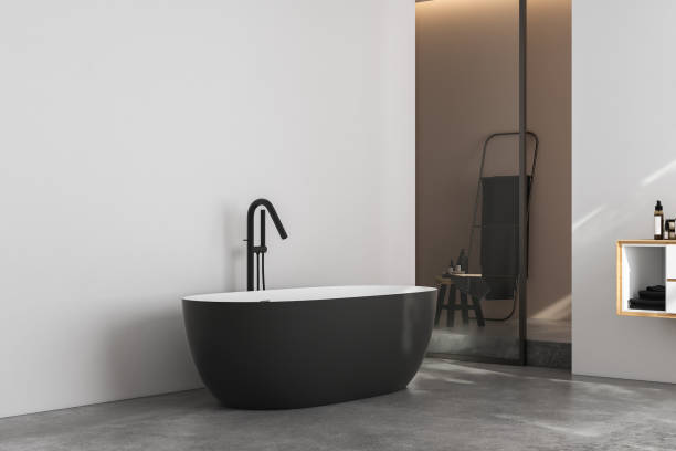 istock Modern minimalist bathroom interior, modern bathroom cabinet, white sink, wooden vanity, interior plants, bathroom accessories, bathtub and shower, white and beige walls, concrete floor. 3d rendering 1440993813