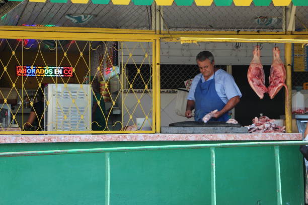 cuba - la havane - butcher in a market stall in downtown havana