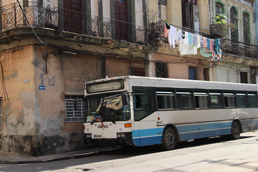 cuba - la havana - old havana -August 7, 2019
 old cuban car -an old passenger coach parks in an alley in the old historic center of havana