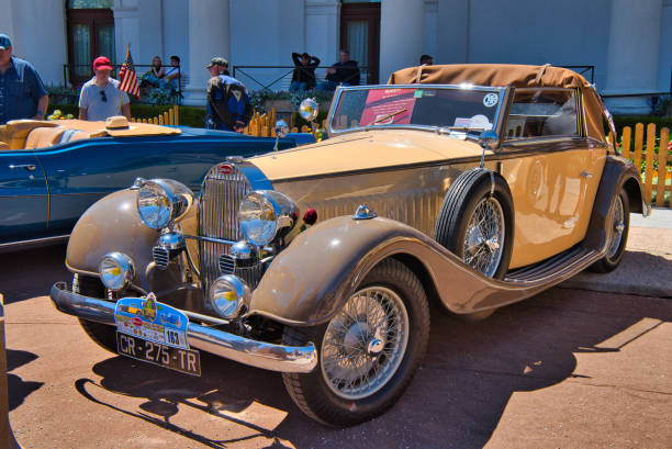 Baden-Baden, Germany - 10 July 2022: beige Bugatti Type 57 Ventoux 1935 135ps cabrio roadster is parked in Kurpark in Baden-Baden at the exhibition of old cars 
