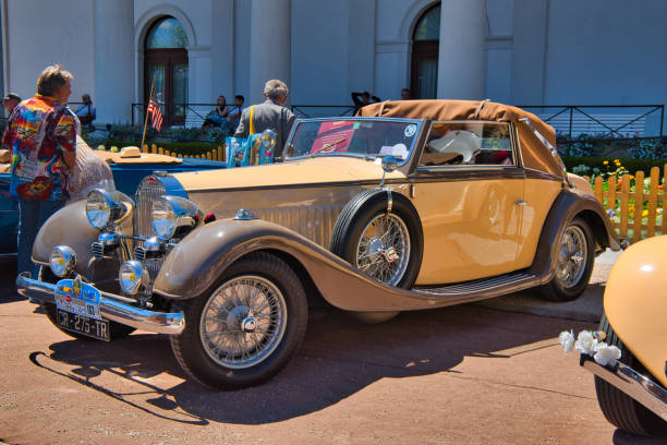 Baden-Baden, Germany - 10 July 2022: beige Bugatti Type 57 Ventoux 1935 135ps cabrio roadster is parked in Kurpark in Baden-Baden at the exhibition of old cars \