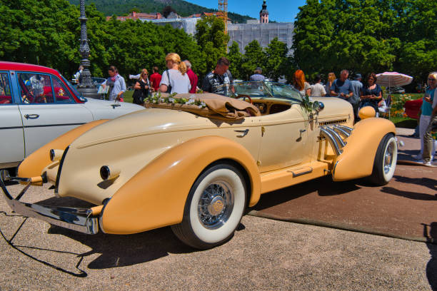 beige 1935 Auburn 851 SC Boattail Speedster Baden-Baden, Germany - 10 July 2022: beige 1935 Auburn 851 SC Boattail Speedster is parked in Kurpark in Baden-Baden at the exhibition of old cars "International Oldtimer Meeting Baden-Baden 2022" 1935 auburn speedster stock pictures, royalty-free photos & images