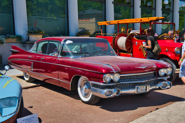 Baden-Baden, Germany - 10 July 2022: red Cadillac Fleetwood 60 Special 1959 is parked in Kurpark in Baden-Baden at the exhibition of old cars \