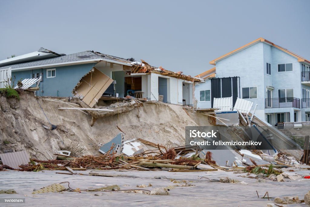 Luxury beach homes collapse under heavy waves caused by Hurricane Nicole Daytona Beach FL Hurricane - Storm Stock Photo