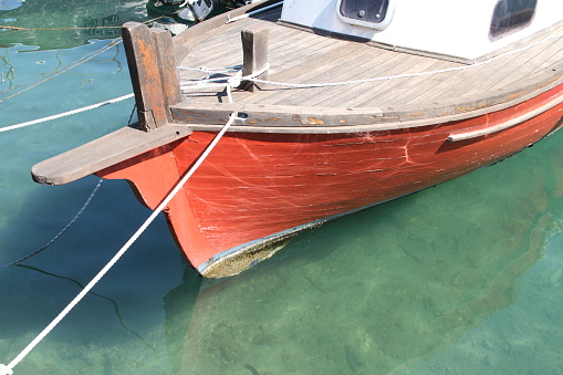 Reflection of wooden yacht in Bodrum harbour
