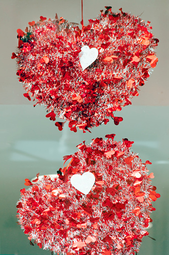 Bright red heart shape figurines close-up.  Christmas or Valentine´s day decoration,