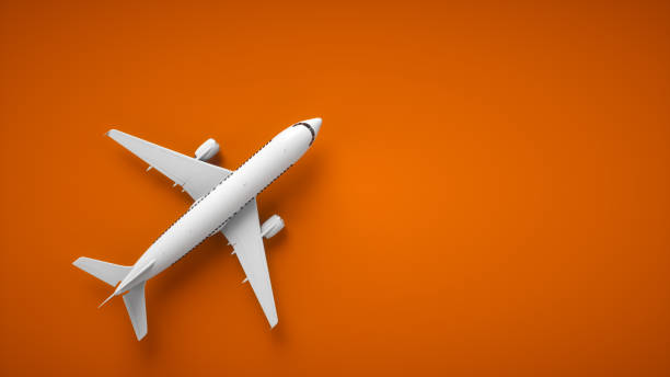 istock Realistic 3D rendering airplane. Aircraft on orange background, top view. 1441006776