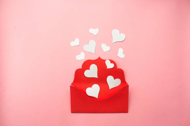 istock Red envelope and white hearts on pink background. Love concept. Saint Valentine's Day concept. Mother's day concept. Flat lay. 1441008768