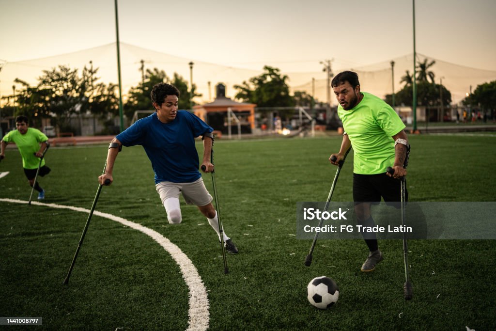 Amputee soccer players in a match on the soccer field Active Lifestyle Stock Photo