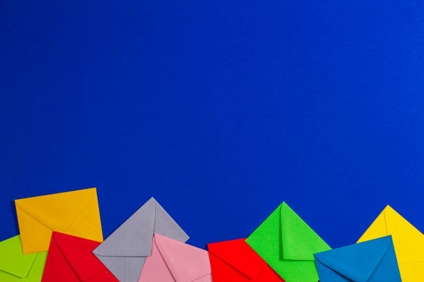 istock Colorful envelopes on blue background, top view 1441009881